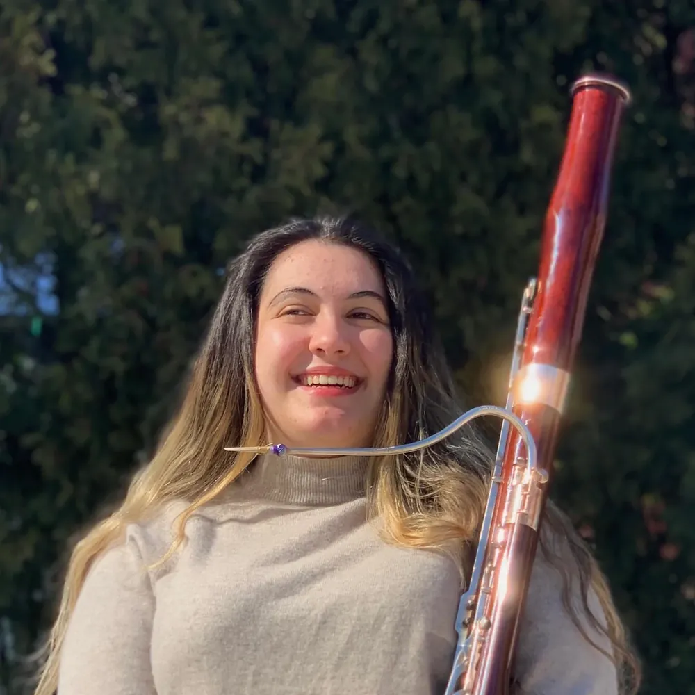 A young bassoonist photographed after the club's music competition